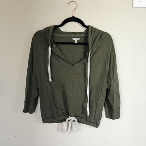 Olive green hooded sweatshirt with cinch waist